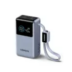 • UGREEN PB727 (75701) Nexode Pro 55W 10000mAh Mini Power Bank is a compact yet high-performance portable charger engineered for fast, intelligent, and convenient power delivery. Featuring up to 55W ultra-fast charging, a built-in USB-C cable, and a smart digital display, it provides powerful charging performance in a travel-friendly size. Built with high-density 21700 lithium-ion battery cells, it ensures efficient energy conversion, durability, and safe charging for smartphones, tablets, and even USB-C laptops. • 55W Ultra-Fast Charging Output delivers high-power charging suitable for smartphones, tablets, gaming devices, and compatible USB-C laptops, with both the built-in USB-C cable and USB-C port supporting up to 55W when used individually. • Built-In USB-C Cable for Maximum Convenience features a durable 22cm nylon-braided cable that doubles as a carrying strap, rated for over 10,000 bends and insertions while eliminating the need for extra cables. • 10,000mAh High-Density Battery uses advanced 21700 lithium-ion cells to provide reliable multi-device charging with an excellent balance between portability and capacity, while remaining airline-safe for travel. • 1.18-Inch Smart Digital Display shows real-time battery percentage, charging wattage, and input/output status, allowing precise monitoring of power usage and charging performance. • Simultaneous Multi-Device Charging supports charging up to three devices at once via the built-in USB-C cable, USB-C port, and USB-A port, with intelligent power distribution for stable performance. • Wide Fast Charging Compatibility supports multiple protocols including PD 3.0, QC 3.0, SCP, FCP, Samsung 45W Fast Charging, and POCO 55W charging, ensuring compatibility across major device brands. • Advanced Safety Protection System incorporates dual intelligent protection chips with safeguards against over-voltage, over-current, overheating, short circuits, and overcharging for secure operation. • Compact & Travel-Friendly Design offers powerful output in a mini form factor that easily fits into pockets, bags, or travel kits, making it ideal for daily commuting, business trips, and outdoor use. Specifications Product Name: UGREEN Nexode Pro Mini Power Bank Model: PB727 SKU: 75701B Battery Capacity: • 10,000mAh Battery Type: • High-Density 21700 Lithium-ion Maximum Output: • 55W Ports: • Built-in USB-C Cable ×1 • USB-C Port ×1 • USB-A Port ×1 Simultaneous Charging: • Up to 3 Devices Display: • 1.18″ Smart Digital Screen Fast Charging Protocols: • PD 3.0 • QC 3.0 • SCP • FCP • Samsung 45W Fast Charging • POCO 55W Charging Dimensions: • 90.3 × 50.5 × 33.5 mm Weight: • Approx. 249 g Features: • 55W high-power fast charging • Built-in USB-C braided cable • Real-time digital power monitoring • Multi-device charging support • Intelligent safety protection system • Compact portable design Suitable For: • Smartphones & Tablets • USB-C Laptops • Gaming Devices • Travel & Daily Carry • Work & Business Use