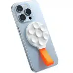 • JOYROOM JR-ZS393 Magnetic Suction Phone Mount is a compact and highly versatile phone holder designed for secure mounting and hands-free usage. Built with powerful N52 magnets and a strong suction cup base, this mount ensures a firm grip on both your device and surfaces. Whether for content creation, video calls, or everyday convenience, it offers reliable stability and portability in a sleek, user-friendly design. • Powerful Magnetic Suction Technology features built-in N52 strong magnets that provide instant attachment and a secure hold, keeping your phone firmly in place even during movement. • Stable Suction Cup Base ensures strong adhesion to smooth surfaces such as glass, tiles, mirrors, or desks, preventing slipping or wobbling during use. • Wide Compatibility supports smartphones ranging from 4.7 to 7.0 inches, including iPhone 12/13/14/15 series with MagSafe support. For non-MagSafe devices, a metal ring can be used for compatibility. • Hands-Free Shooting Solution is perfect for content creators, vloggers, and live streamers, allowing stable phone positioning for recording videos or taking photos without holding the device. • Portable & Compact Design makes it easy to carry in your pocket, bag, or travel kit, ensuring convenience wherever you go. • Durable Build Quality constructed with high-quality ABS, PC, and silicone materials for long-lasting performance and reliability. • Silicone Strap Design adds extra convenience, allowing you to hang, carry, or store the mount easily when not in use. Specifications Product Name: JOYROOM JR-ZS393 Magnetic Suction Phone Mount Model: • JR-ZS393 Material: • ABS + PC + Silicone Magnetic Type: • N52 Strong Magnets Mounting Type: • Suction Cup + Magnetic Attachment Compatible Phone Size: • 4.7 – 7.0 inches Compatibility: • iPhone 12 / 13 / 14 / 15 series (MagSafe supported) • Other smartphones with metal ring attachment Design Features: • Compact and lightweight • Silicone strap for easy carrying • Stable suction base Functions: • Magnetic phone mounting • Hands-free video recording • Live streaming support • Portable usage Usage Scenarios: • Content creation • Video calls • Desk setup • Travel and outdoor use