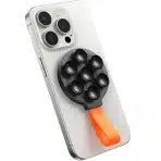 • JOYROOM JR-ZS393 Magnetic Suction Phone Mount is a compact and highly versatile phone holder designed for secure mounting and hands-free usage. Built with powerful N52 magnets and a strong suction cup base, this mount ensures a firm grip on both your device and surfaces. Whether for content creation, video calls, or everyday convenience, it offers reliable stability and portability in a sleek, user-friendly design. • Powerful Magnetic Suction Technology features built-in N52 strong magnets that provide instant attachment and a secure hold, keeping your phone firmly in place even during movement. • Stable Suction Cup Base ensures strong adhesion to smooth surfaces such as glass, tiles, mirrors, or desks, preventing slipping or wobbling during use. • Wide Compatibility supports smartphones ranging from 4.7 to 7.0 inches, including iPhone 12/13/14/15 series with MagSafe support. For non-MagSafe devices, a metal ring can be used for compatibility. • Hands-Free Shooting Solution is perfect for content creators, vloggers, and live streamers, allowing stable phone positioning for recording videos or taking photos without holding the device. • Portable & Compact Design makes it easy to carry in your pocket, bag, or travel kit, ensuring convenience wherever you go. • Durable Build Quality constructed with high-quality ABS, PC, and silicone materials for long-lasting performance and reliability. • Silicone Strap Design adds extra convenience, allowing you to hang, carry, or store the mount easily when not in use. Specifications Product Name: JOYROOM JR-ZS393 Magnetic Suction Phone Mount Model: • JR-ZS393 Material: • ABS + PC + Silicone Magnetic Type: • N52 Strong Magnets Mounting Type: • Suction Cup + Magnetic Attachment Compatible Phone Size: • 4.7 – 7.0 inches Compatibility: • iPhone 12 / 13 / 14 / 15 series (MagSafe supported) • Other smartphones with metal ring attachment Design Features: • Compact and lightweight • Silicone strap for easy carrying • Stable suction base Functions: • Magnetic phone mounting • Hands-free video recording • Live streaming support • Portable usage Usage Scenarios: • Content creation • Video calls • Desk setup • Travel and outdoor use