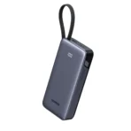 • UGREEN PB536 (55988B) Nexode Power Bank 20000mAh 45W with Built-in Cable is a premium high-capacity fast charging power bank designed for professionals, travelers, and everyday users who need reliable portable power. Featuring up to 45W USB-C fast charging, a built-in braided USB-C cable, and multi-device charging support, this compact power bank keeps smartphones, tablets, and accessories powered throughout the day. With a smart LED battery display and durable premium construction, it delivers convenience, speed, and long-lasting performance wherever you go. • 45W USB-C Fast Charging Output delivers rapid charging for smartphones, tablets, and compatible laptops, making it ideal for modern high-power devices. • Built-in Braided USB-C Cable provides convenient cable-free charging and recharging, eliminating the need to carry extra accessories. • Dual-Purpose Integrated Cable supports both input and output charging, allowing the power bank itself to recharge through the same built-in cable. • 3 Outputs for Simultaneous Charging includes built-in USB-C cable, USB-C port, and USB-A port to power up to three devices at once. • 20000mAh High-Capacity Battery provides multiple recharges for phones and extended backup power for tablets or accessories. • Smart LED Battery Display shows real-time remaining battery percentage for accurate power management. • 8.6-inch (22cm) Cable Length offers practical reach for charging while holding your phone or keeping devices nearby. • Braided Cable with Carry Loop Design resists tangling and wear while also functioning as a convenient carrying strap. • Wide Device Compatibility supports iPhone, Samsung Galaxy, iPad, earbuds, smartwatches, and many USB-powered devices. • Premium Fire-Resistant Build made from durable PC + Aluminum Alloy for better durability and heat resistance. Specifications Product Name: UGREEN PB536 (55988B) Nexode Power Bank 20000mAh 45W with Built-in Cable Brand: • UGREEN Model / SKU: • PB536 / 55988B Battery Capacity: • 20000mAh (Typical) Maximum Output Power: • Up to 45W Charging Ports / Outputs: • Built-in USB-C Cable • 1 × USB-C Port • 1 × USB-A Port Total Outputs: • Charge up to 3 devices simultaneously Input: • 5V–20V ⎓ 3.25A (Max) Built-in Cable Length: • 8.6 inches / 22 cm Display: • LED Battery Indicator Material: • Fire-resistant PC + Aluminum Alloy Features: • 45W fast charging • Built-in braided USB-C cable • Charge & recharge via same cable • 3-device simultaneous charging • 20000mAh large capacity • LED battery percentage display • Portable carry loop cable design • Wide device compatibility
