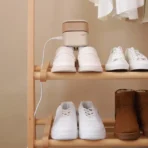 Xiaomi Sothing Shoe Dryer - SUNSHINE Xiaomi Sothing DSHJ-S-2110 Shoe Dryer - SUNSHINE Get rid of moisture from your shoes once and for all! The Sothing DSHJ-S-2110 shoe dryer comes to the rescue whenever your shoes are wet from rain or damp after an intense workout. The warm air combined with the clever design allows you to prepare your shoes for reuse in no time. The dryer is also compact, so it can accompany you anywhere. It's worth having it at hand! The product is equipped with a plug for a European outlet. Drying with hot air The device uses a hot air circulation system that effectively distributes heat inside the shoe, reaching even hard-to-reach places. It emits a stream of hot air at a temperature of about 60°C, which ensures fast and even drying of shoes. Safe and convenient use The Sothing DSHJ-S-2110 dryer is designed with safety in mind. The housing is made of heat-resistant material that will not deform under high temperatures. A built-in temperature sensor automatically shuts down the device if excessive heat is detected, preventing the risk of overheating. The timer function allows you to set the drying time (3, 6 or 9 hours), adjusting it according to the type of shoes and moisture level. Portable design Winter weekend in the mountains? Don't let wet shoes and clothes spoil your fun! Thanks to its lightweight and foldable design, the Sothing dryer is ideal for use at home and on the go. The small dimensions of the device (16 x 11 x 6 cm) and its weight (0.32 kg) make it easy to pack in your bag or backpack. It's a portable solution that will work not only for shoes, but also for gloves, socks or other accessories made of different materials, such as leather, rubber, cotton or suede. Included Shoe dryer Power cable Manufacturer Sothing Manufacturer code DSHJ-S-2110 Name Hot air shoe dryer Rated voltage 110 V/50-60 Hz Rated power 100 W Cable length 1 m Size 16 x 11 x 6 cm Weight 0.32 kg Shoe drying temperature Approximately 60°C
