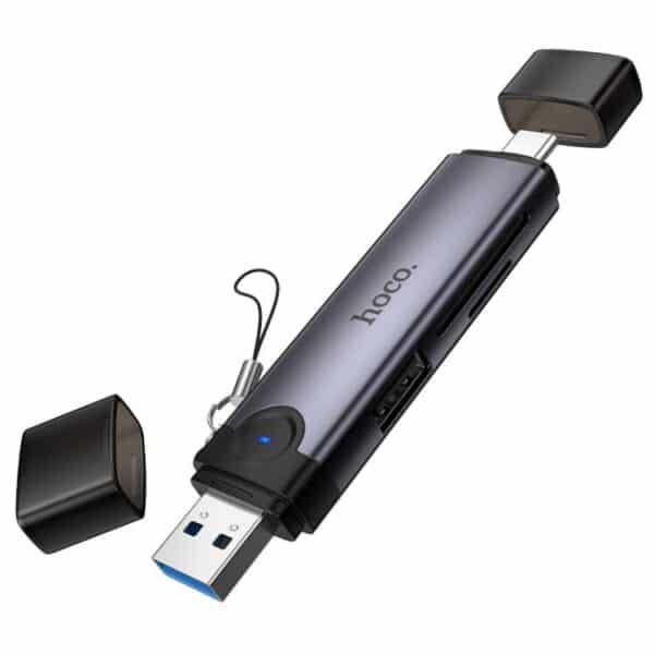Hoco HB56 Victory USB/Type-C 3-in-1 Card Reader 1. Material: Aluminum Alloy 2. Dimensions: 95.6 x 20.7 x 10.5 mm 3. Weight: 19g 4. Interface: USB-A, Type-C to SD cards, TF 3.0 cards, and USB 2.0 5. Theoretical Transmission Speed: USB 2.0: 480 Mbps; SD and TF 3.0 cards: 5 Gbps 6. Supports memory cards with a maximum capacity of up to 2TB. 7. Plug and play, no driver installation required, easy to use. 8. Supports universal connectivity via both USB-A and USB-C interfaces, enabling high-speed data reading; offers broad compatibility and is suitable for use with a wide range of devices.